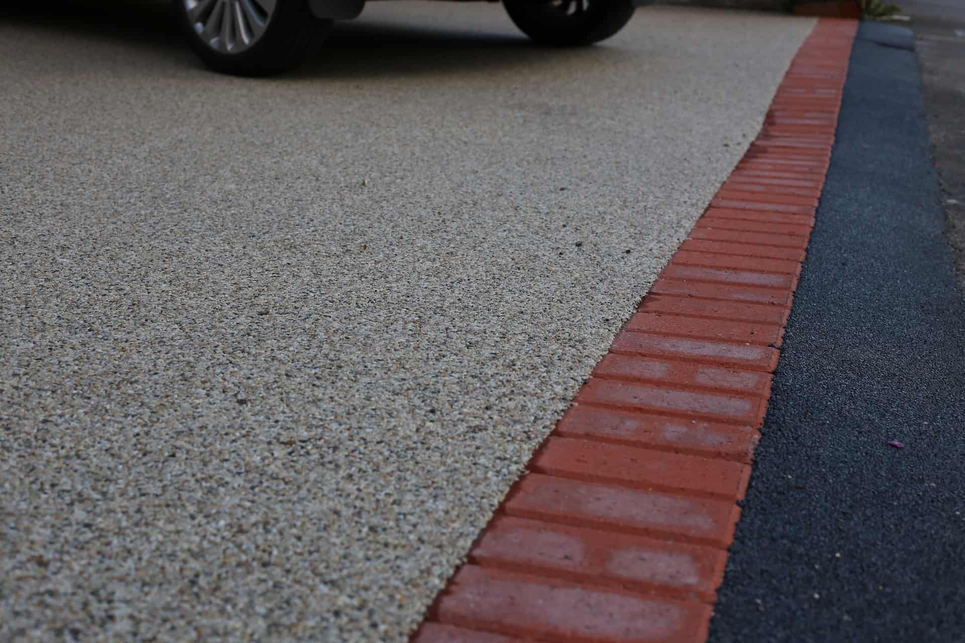 Close-up of a smooth, permeable resin bound surface laid on a commercial site in Godalming